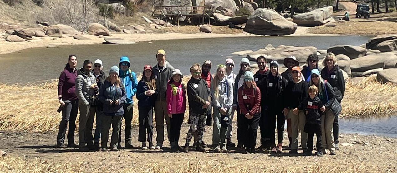 large group standing together in mountain landscape